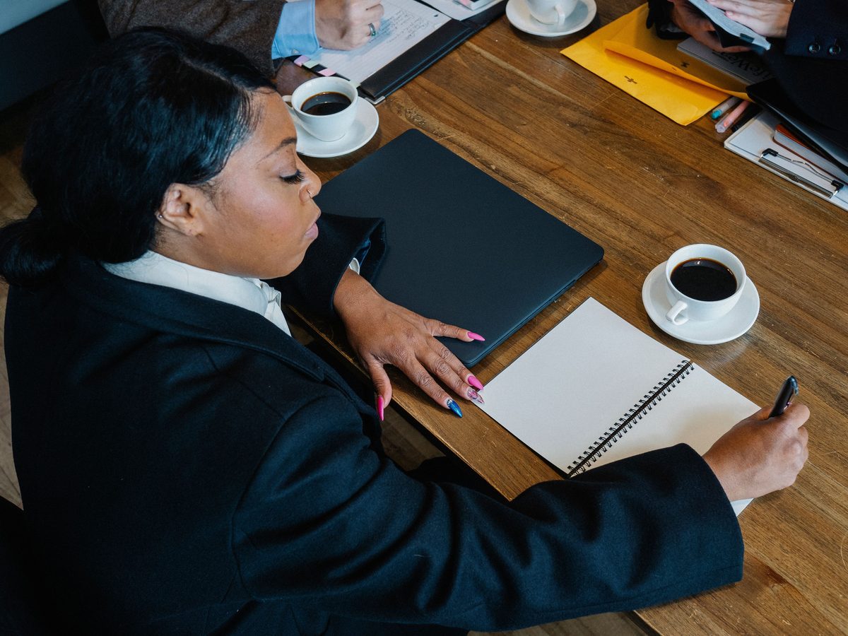 Visa consultant reviewing documents with a Kenyan client
